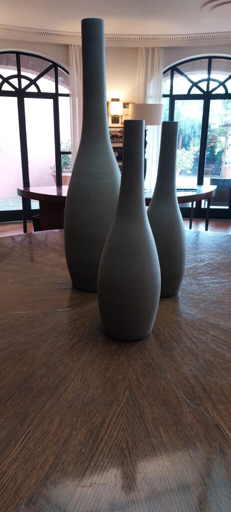 A Morandi-style still life of vases in the foyer of the Hotel Il Ciocco near Barga